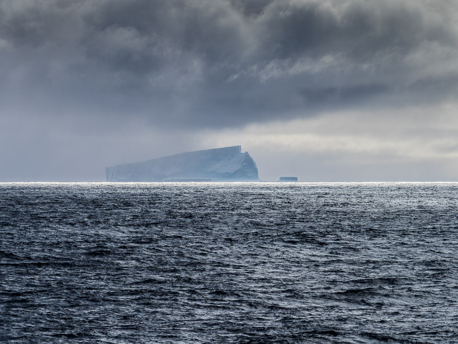 Iceberg and Moody Sky